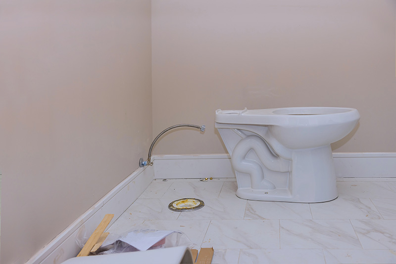 New Toilet Bowl Positioned Over Floor Flange for Install new toilet bowl positioned over floor flange during installation with supply line