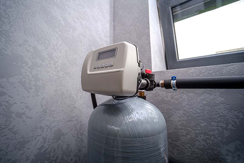 Water Softener System Control Head Connected to Supply Line water softener system control head connected to residential supply line